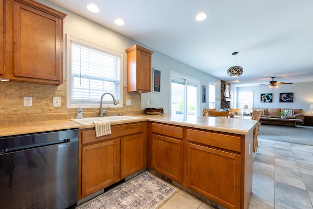 502 Deerpath St, Tolono, IL 61880 - kitchen with dishwasher, a sink, a peninsula, plenty of natural light, and recessed lighting