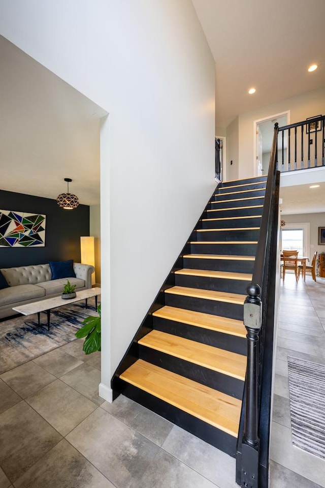 502 Deerpath St, Tolono, IL 61880 - staircase featuring recessed lighting and baseboards