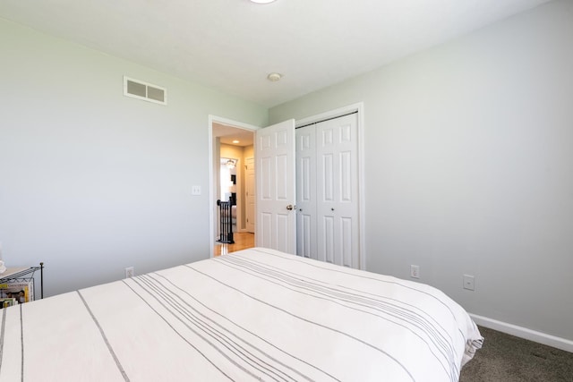 502 Deerpath St, Tolono, IL 61880 - bedroom featuring a closet, baseboards, and carpet floors