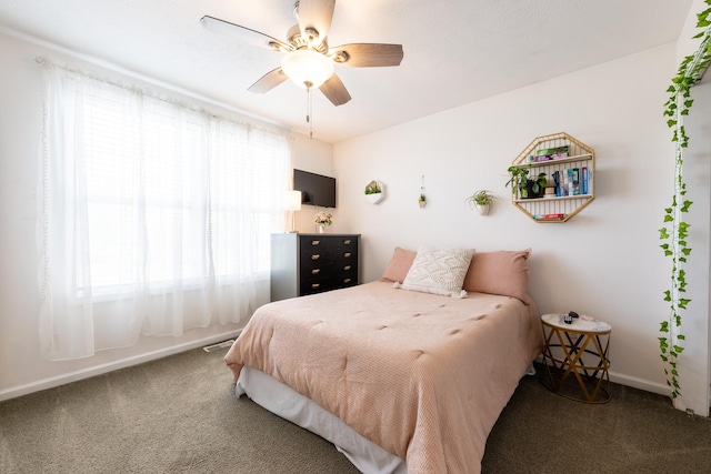 502 Deerpath St, Tolono, IL 61880 - carpeted bedroom featuring baseboards and ceiling fan
