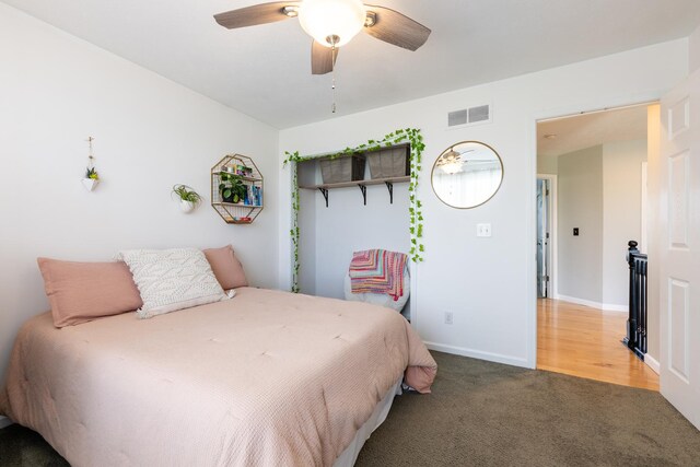 502 Deerpath St, Tolono, IL 61880 - bedroom featuring carpet, baseboards, and a ceiling fan