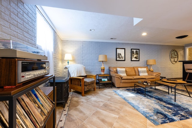 502 Deerpath St, Tolono, IL 61880 - living room with brick wall, a textured ceiling, recessed lighting, and ornamental molding