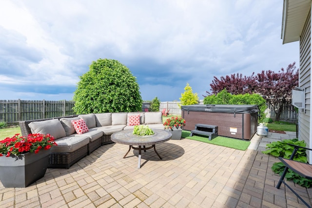 502 Deerpath St, Tolono, IL 61880 - view of patio / terrace featuring a hot tub and an outdoor hangout area