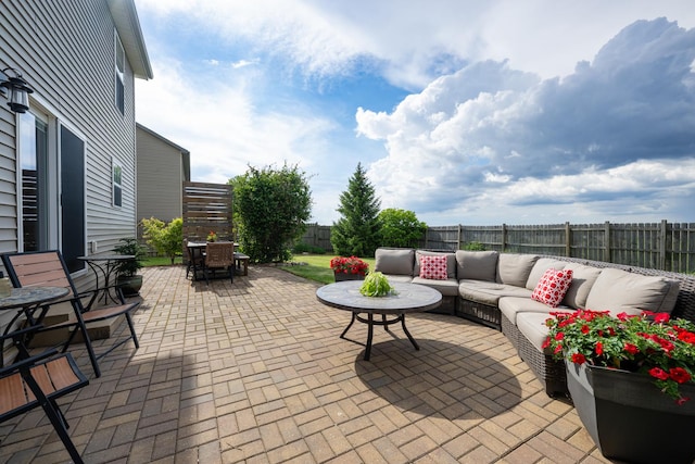 502 Deerpath St, Tolono, IL 61880 - fenced backyard with an outdoor living space, a patio area, and outdoor dining area