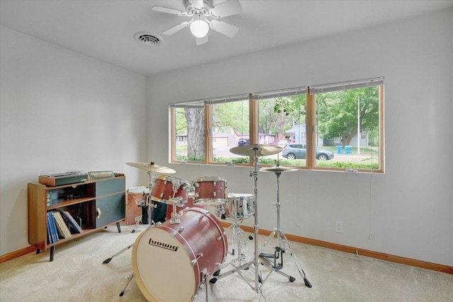 playroom with carpet, baseboards, and ceiling fan
