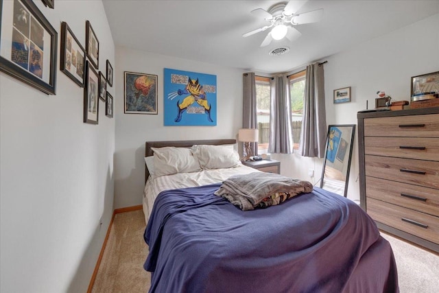 bedroom featuring carpet flooring, baseboards, and a ceiling fan