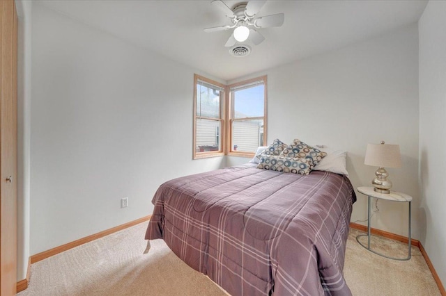 bedroom with baseboards, carpet floors, and ceiling fan