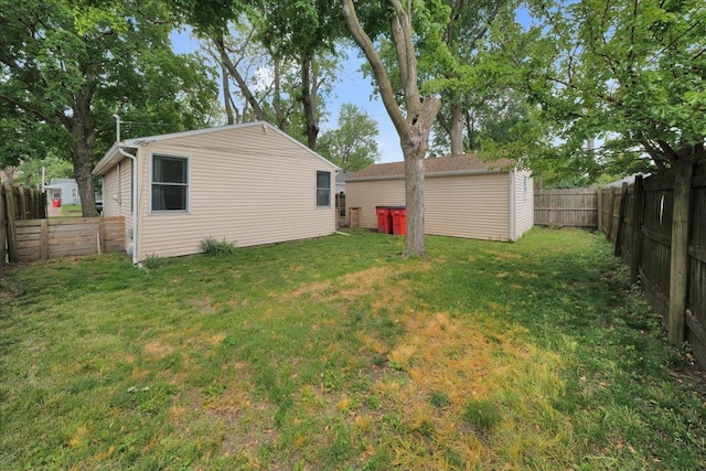 view of yard featuring an outbuilding and a shed