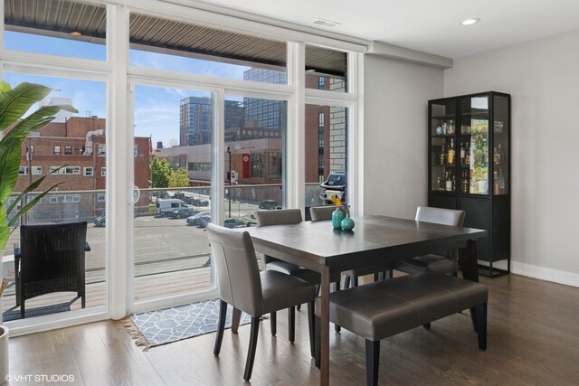 236 S Racine Ave Unit 304, Chicago, IL 60607 - dining area with a view of city, wood finished floors, recessed lighting, and baseboards