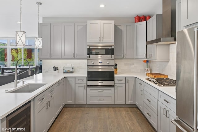 236 S Racine Ave Unit 304, Chicago, IL 60607 - kitchen with appliances with stainless steel finishes, wine cooler, wall chimney range hood, light countertops, and backsplash