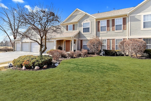 view of front of home with driveway and a front lawn