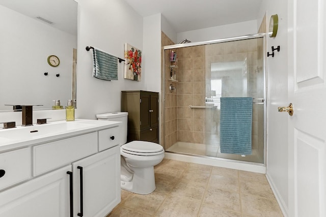 full bath featuring toilet, a shower stall, vanity, and tile patterned flooring