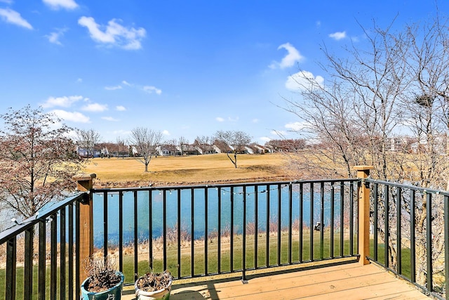 wooden deck featuring a water view
