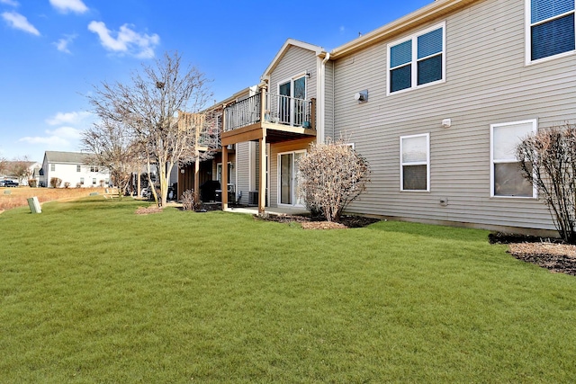 back of house with a yard