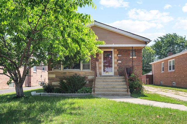 8941 S Albany Ave, Evergreen Park, IL 60805 - view of front of home with brick siding and a front yard