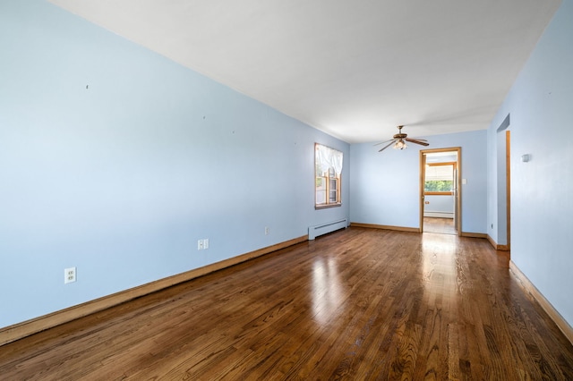 8941 S Albany Ave, Evergreen Park, IL 60805 - spare room featuring a baseboard radiator, wood finished floors, baseboard heating, and ceiling fan