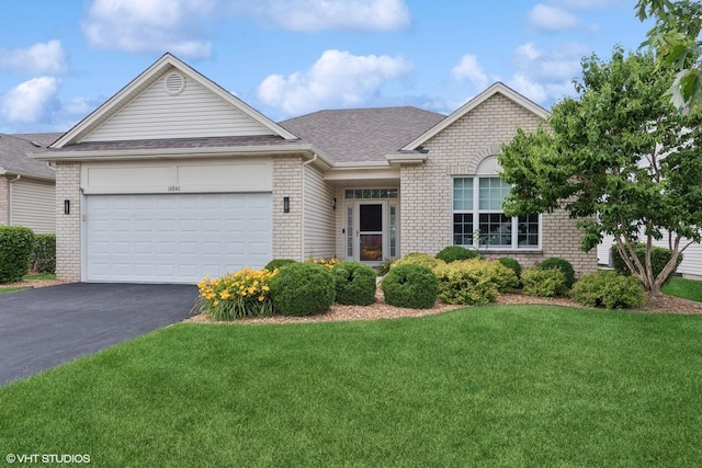 16840 Balaton Dr, Lockport, IL 60441 - view of front of house with brick siding, a front lawn, asphalt driveway, an attached garage, and roof with shingles