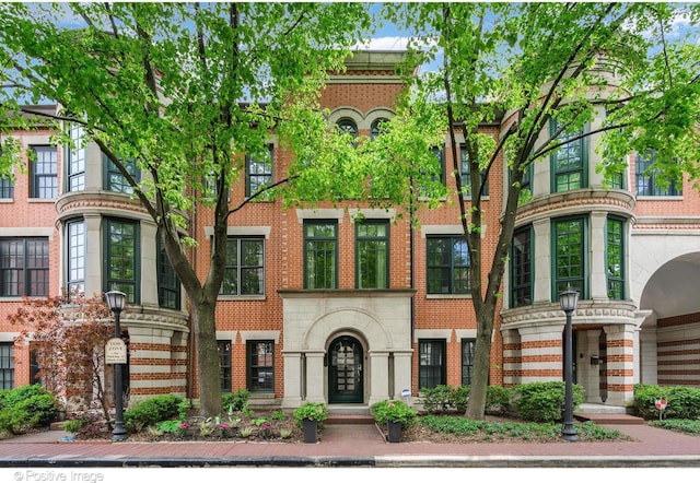 view of front of house with brick siding