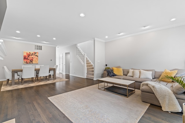 living room with stairs, wood finished floors, baseboards, recessed lighting, and ornamental molding