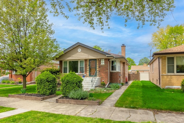 bungalow featuring a chimney and brick siding