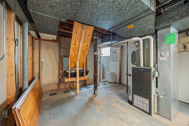 below grade area featuring heating unit