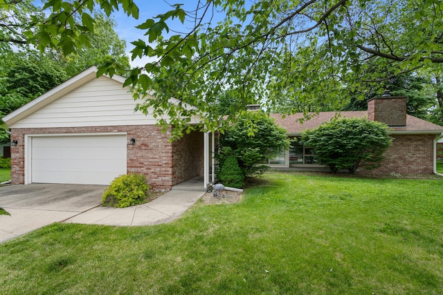 911 S Hamilton St, Monticello, IL 61856 - view of front of house with concrete driveway, a front yard, brick siding, and a chimney