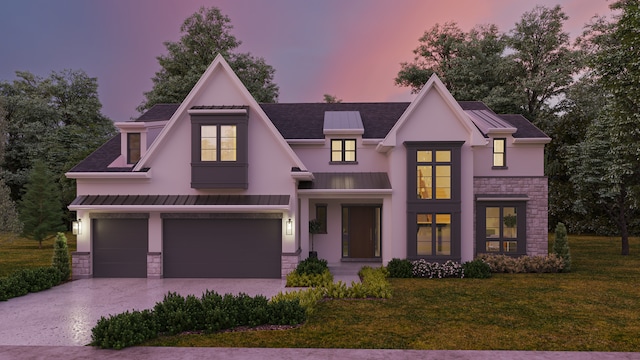 view of front facade with stone siding, a front lawn, driveway, a standing seam roof, and stucco siding