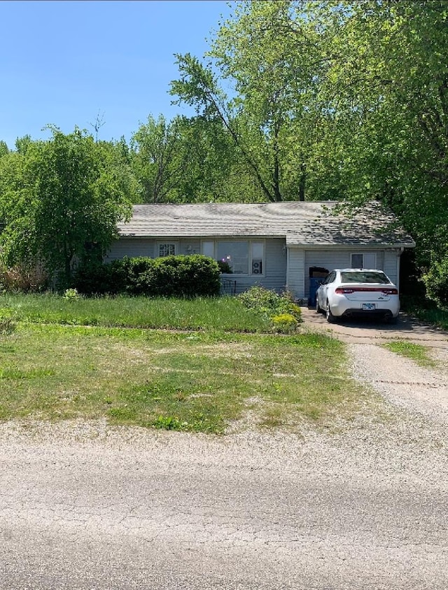 408 E Kyle St, Ogden, IL 61859 - view of side of home with a garage and driveway