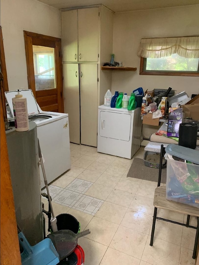 408 E Kyle St, Ogden, IL 61859 - laundry area featuring cabinet space and independent washer and dryer