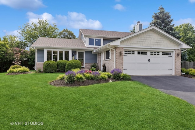 3 Starwood Ct, Bolingbrook, IL 60490 - tri-level home with a chimney, brick siding, driveway, an attached garage, and a front yard
