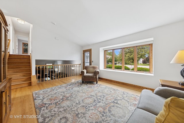 3 Starwood Ct, Bolingbrook, IL 60490 - living area with wood finished floors, lofted ceiling, and baseboards