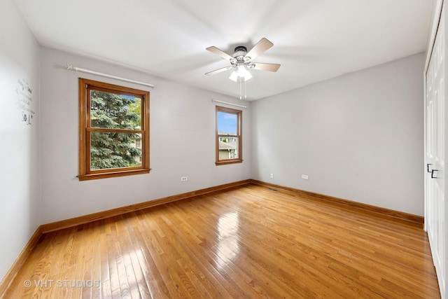 3 Starwood Ct, Bolingbrook, IL 60490 - spare room featuring light wood finished floors, baseboards, and ceiling fan