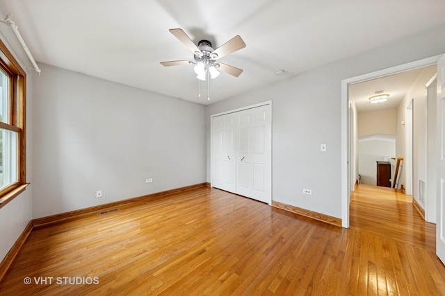 3 Starwood Ct, Bolingbrook, IL 60490 - unfurnished bedroom with light wood-type flooring, baseboards, a closet, and ceiling fan