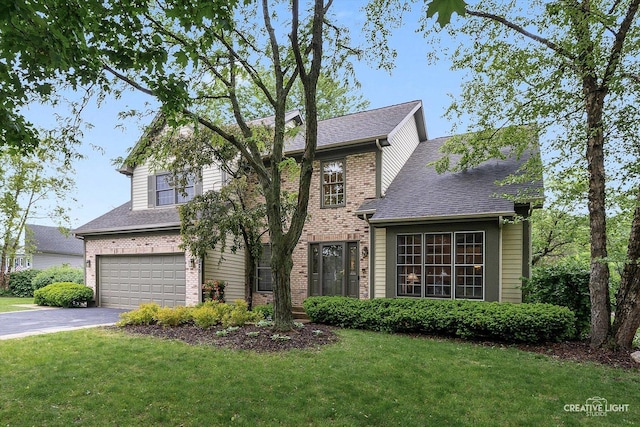 1070 Hobble Bush Ln, Elgin, IL 60120 - traditional home featuring a garage, asphalt driveway, brick siding, and a front lawn