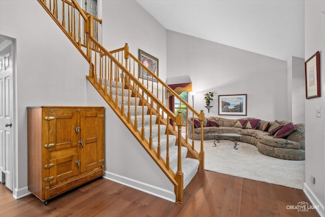 1070 Hobble Bush Ln, Elgin, IL 60120 - stairway featuring a high ceiling, wood finished floors, and baseboards