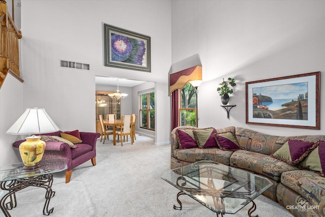 1070 Hobble Bush Ln, Elgin, IL 60120 - living area with a chandelier, a high ceiling, carpet flooring, and baseboards