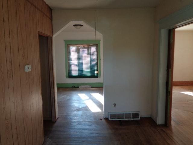 308 Genoa St, Cherry Valley, IL 61016 - hall featuring wood finished floors, baseboards, and wood walls