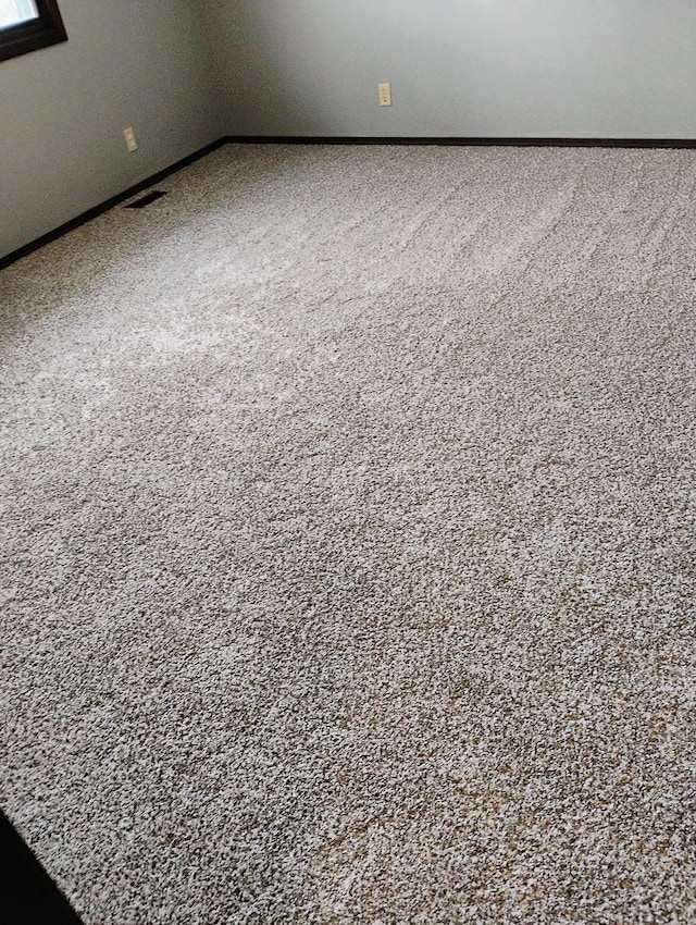 detailed view of baseboards and carpet floors