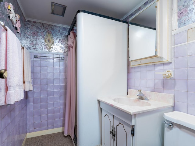 4949 W Deming Pl, Chicago, IL 60639 - full bathroom featuring vanity, toilet, tile walls, a shower with curtain, and ornamental molding