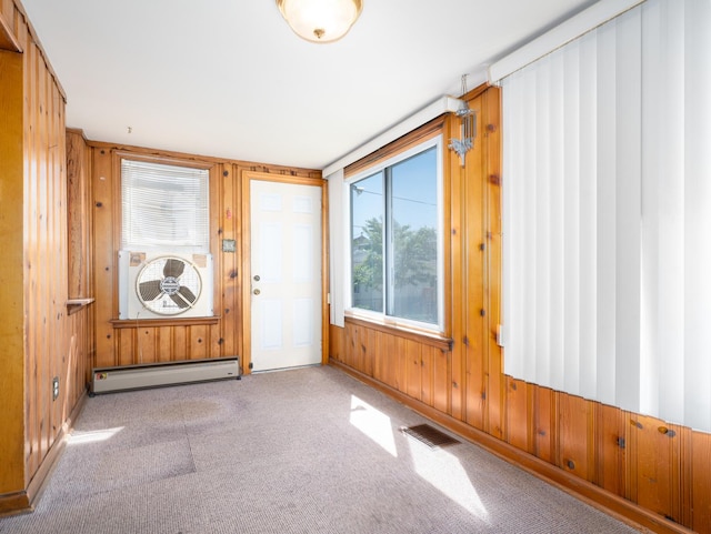 4949 W Deming Pl, Chicago, IL 60639 - carpeted entrance foyer featuring a baseboard radiator and wood walls