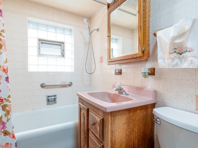 4949 W Deming Pl, Chicago, IL 60639 - full bathroom with tile walls, toilet, vanity, and shower / tub combo with curtain