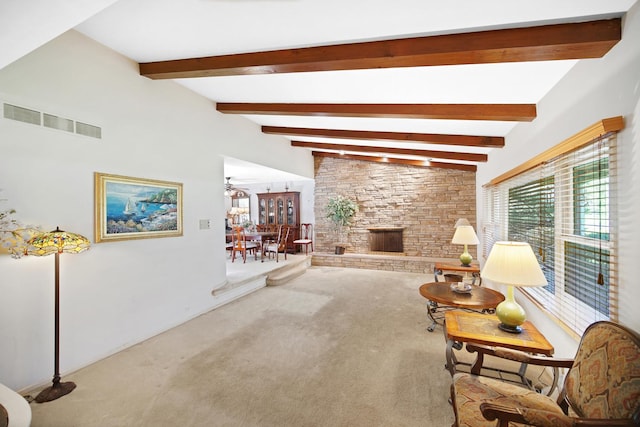 32381 N Forest Dr, Grayslake, IL 60030 - living area with carpet floors, beamed ceiling, and a stone fireplace