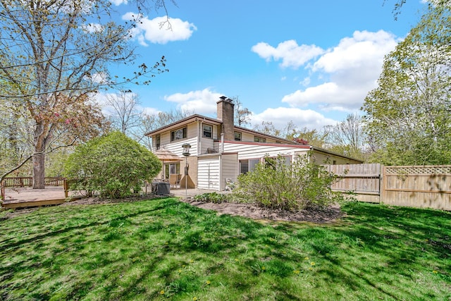32381 N Forest Dr, Grayslake, IL 60030 - rear view of house featuring a chimney, a wooden deck, and central AC unit