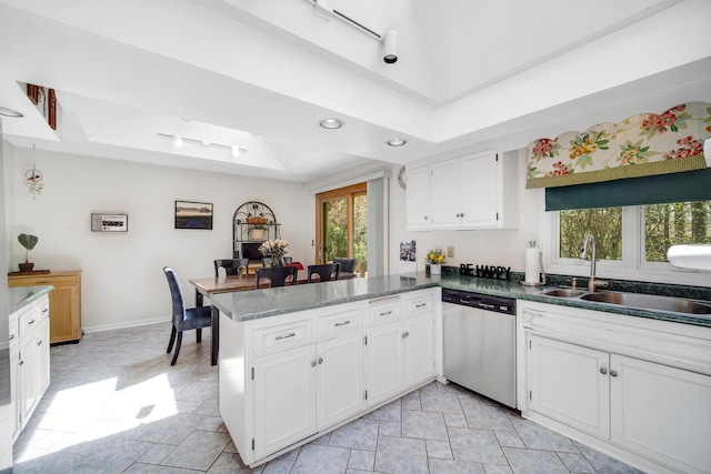 32381 N Forest Dr, Grayslake, IL 60030 - kitchen with dishwasher, a sink, a peninsula, white cabinets, and a raised ceiling