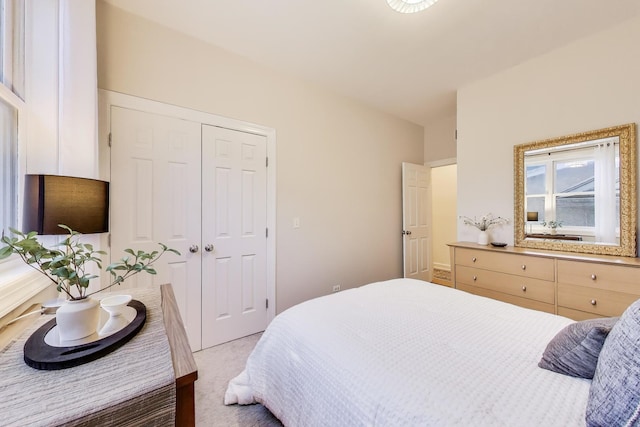 carpeted bedroom with a closet