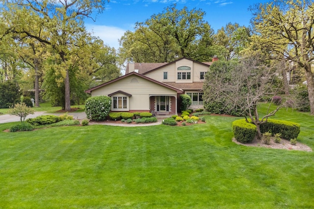 6 Old Timber Ln, Palos Park, IL 60464 - view of front of house with a front yard, a chimney, brick siding, and roof with shingles