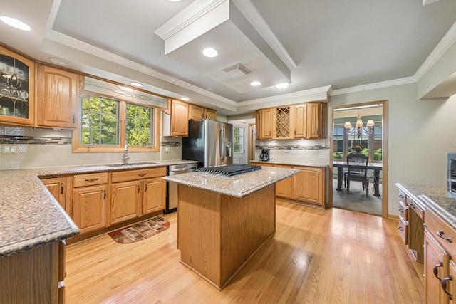6 Old Timber Ln, Palos Park, IL 60464 - kitchen featuring stainless steel appliances, a sink, light wood finished floors, ornamental molding, and decorative backsplash
