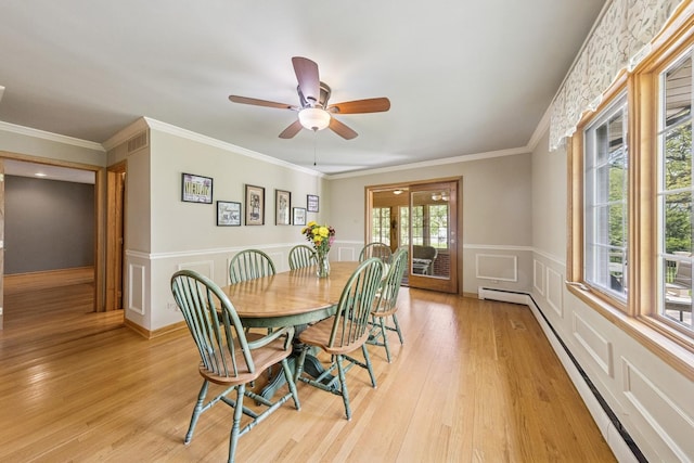 6 Old Timber Ln, Palos Park, IL 60464 - dining area featuring a baseboard radiator, light wood finished floors, a ceiling fan, a wainscoted wall, and ornamental molding