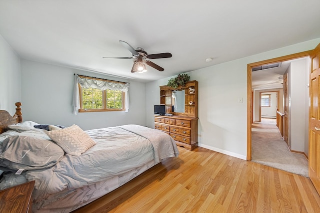6 Old Timber Ln, Palos Park, IL 60464 - bedroom with multiple windows, light wood-type flooring, baseboards, and ceiling fan