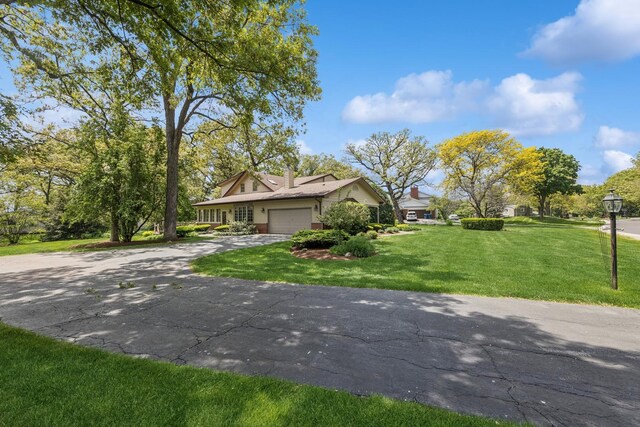 6 Old Timber Ln, Palos Park, IL 60464 - view of front of property with asphalt driveway, an attached garage, a front lawn, and a chimney